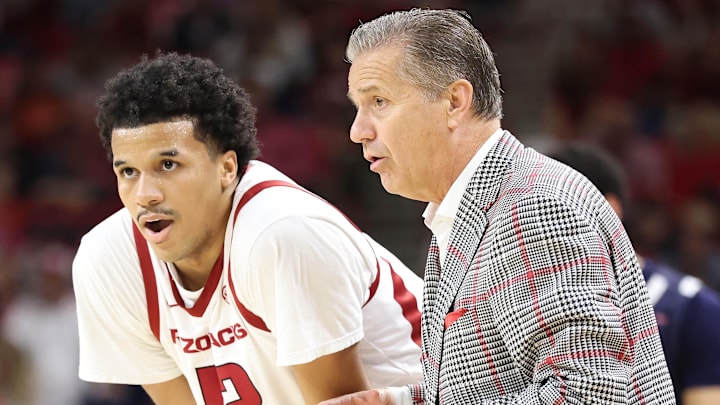 Arkansas Razorbacks forward Malique Ewin talks to coach John Calipari during the second half against the Jackson State Tigers at Bud Walton Arena. Arkansas won 115-61. Arkansas Razorbacks forward Malique Ewin talks to coach John Calipari during the second half against the Jackson State Tigers at Bud Walton Arena. Arkansas won 115-61.
