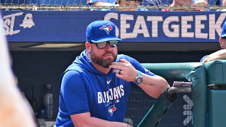 Aug 9, 2026; Philadelphia, Pennsylvania, USA; Toronto Blue Jays manager John Schneider (14) looks on from the dugout against the Philadelphia Phillies during the sixth inning at Citizens Bank Park. Mandatory Credit: Eric Hartline-Imagn Images Aug 9, 2026; Philadelphia, Pennsylvania, USA; Toronto Blue Jays manager John Schneider (14) looks on from the dugout against the Philadelphia Phillies during the sixth inning at Citizens Bank Park. Mandatory Credit: Eric Hartline-Imagn Images