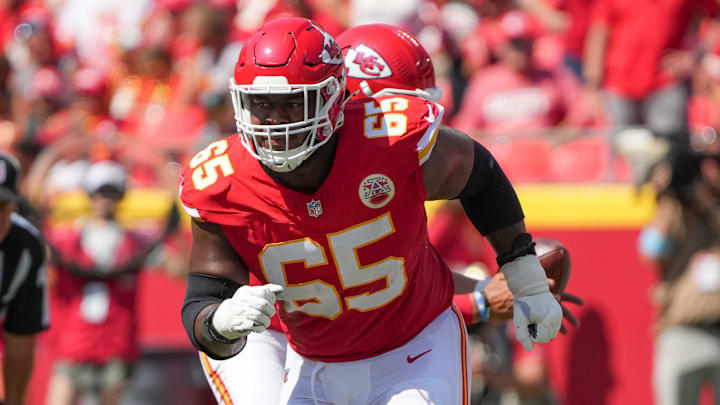 Aug 17, 2024; Kansas City, Missouri, USA; Kansas City Chiefs guard Trey Smith (65) prepares to block against the Detroit Lions during the game at GEHA Field at Arrowhead Stadium. Mandatory Credit: Denny Medley-Imagn Images