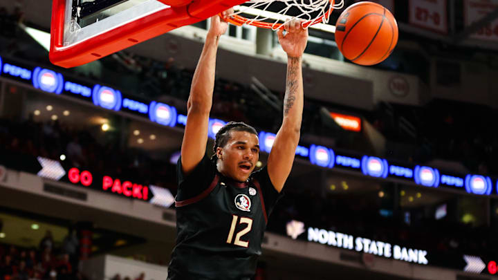 Dec 7, 2024; Raleigh, North Carolina, USA; Florida State Seminoles forward Malique Ewin (12) dunks against the North Carolina State Wolfpack during the second half at Lenovo Center. Mandatory Credit: Jaylynn Nash-Imagn Images Dec 7, 2024; Raleigh, North Carolina, USA; Florida State Seminoles forward Malique Ewin (12) dunks against the North Carolina State Wolfpack during the second half at Lenovo Center. Mandatory Credit: Jaylynn Nash-Imagn Images