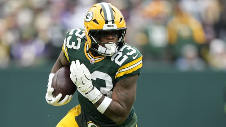 Green Bay Packers running back Emanuel Wilson (23) carries the ball against the Minnesota Vikings during the first half at Lambeau Field.