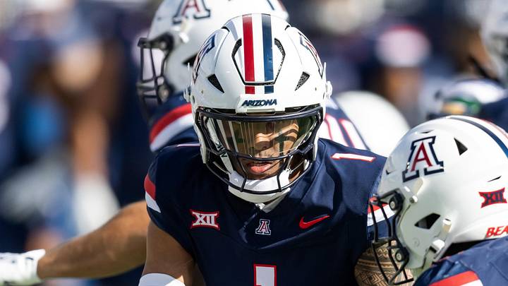 Nov 22, 2025; Tucson, Arizona, USA; Arizona Wildcats quarterback Noah Fifita (1) hands off the ball to running back Ismail Mahdi (21) against the Baylor Bears at Casino Del Sol Stadium. Mandatory Credit: Mark J. Rebilas-Imagn Images