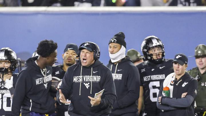 Oct 25, 2025; Morgantown, West Virginia, USA; West Virginia Mountaineers head coach Rich Rodriguez yells from the sideline late in the second quarter against the Texas Christian University Horned Frogs at Milan Puskar Stadium. Mandatory Credit: Ben Queen-Imagn Images