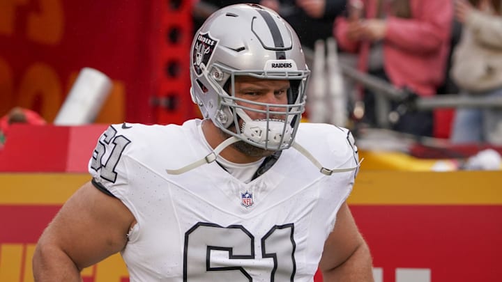 Dec 25, 2023; Kansas City, Missouri, USA; Las Vegas Raiders guard Jordan Meredith (61) runs onto the field against the Kansas City Chiefs prior to a game at GEHA Field at Arrowhead Stadium. Mandatory Credit: Denny Medley-Imagn Images