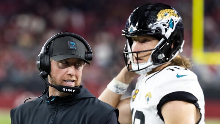 Nov 23, 2025; Glendale, Arizona, USA; Jacksonville Jaguars head coach Liam Coen with quarterback Trevor Lawrence (16) against the Arizona Cardinals at State Farm Stadium. Mandatory Credit: Mark J. Rebilas-Imagn Images