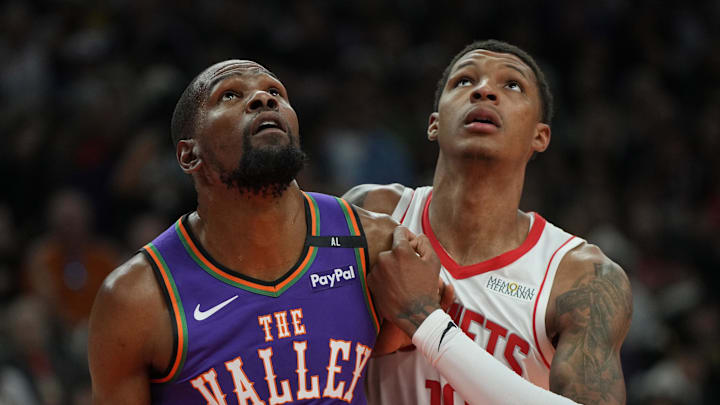 Mar 30, 2025; Phoenix, Arizona, USA; Phoenix Suns forward Kevin Durant (35) and Houston Rockets forward Jabari Smith Jr. (10) fight for position in the first half at Footprint Center. Mandatory Credit: Rick Scuteri-Imagn Images
