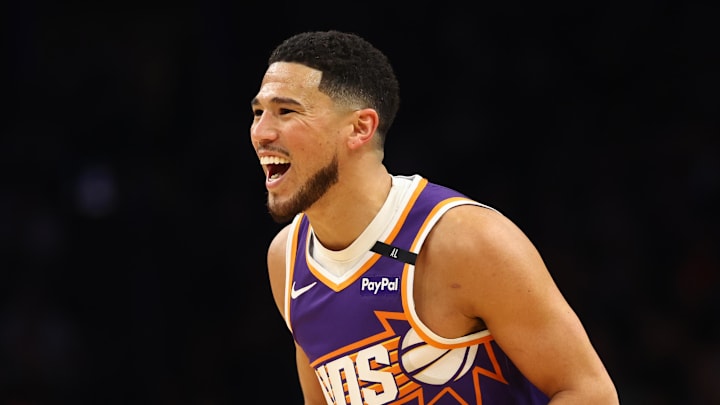 Mar 24, 2025; Phoenix, Arizona, USA; Phoenix Suns guard Devin Booker (1) reacts against the Milwaukee Bucks at Footprint Center. Mandatory Credit: Mark J. Rebilas-Imagn Images