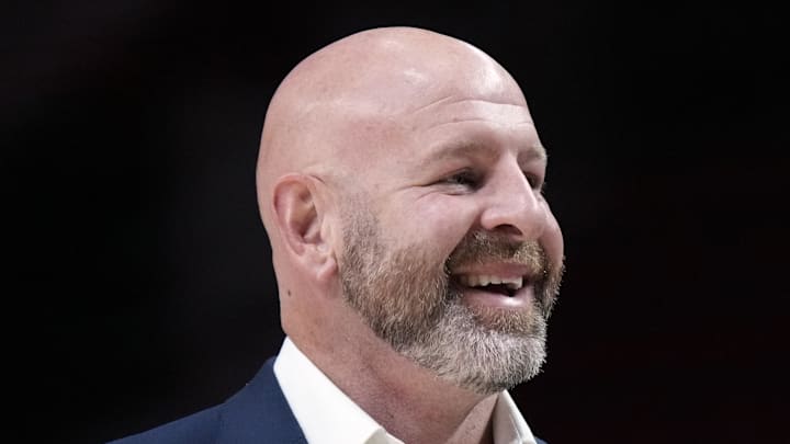 Portland Trail Blazers general manager Joe Cronin smiles as players warm up before a game against the New Orleans Pelicans.
