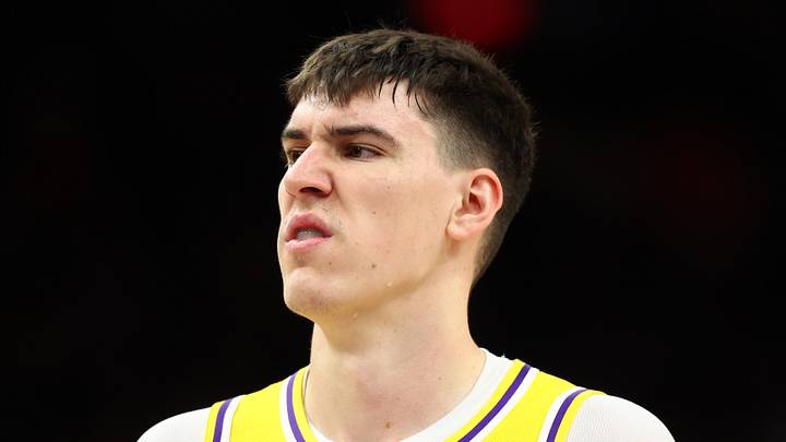 Dec 23, 2025; Phoenix, Arizona, USA; Los Angeles Lakers forward Jake LaRavia (12) against the Phoenix Suns at Mortgage Matchup Center. Mandatory Credit: Mark J. Rebilas-Imagn Images