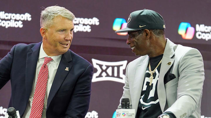 Jul 9, 2025; Frisco, TX, USA; Arizona head coach Brent Brennan and Colorado head coach Deion Sanders talk on stage during 2025 Big 12 Football Media Days at The Star. Mandatory Credit: Raymond Carlin III-Imagn Images Jul 9, 2025; Frisco, TX, USA; Arizona head coach Brent Brennan and Colorado head coach Deion Sanders talk on stage during 2025 Big 12 Football Media Days at The Star. Mandatory Credit: Raymond Carlin III-Imagn Images