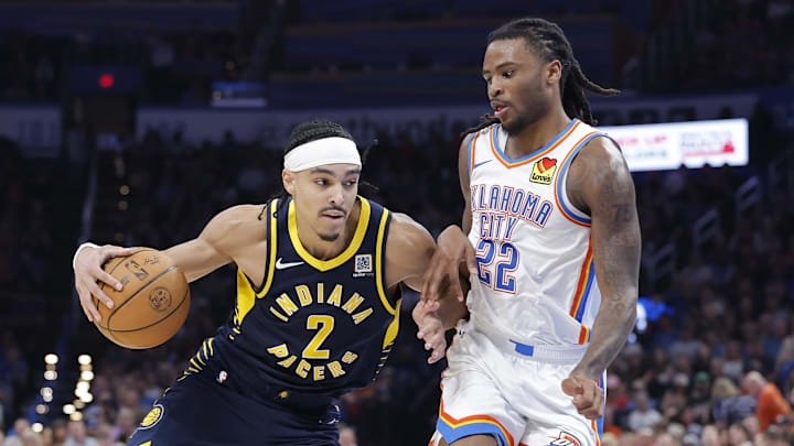 Indiana Pacers guard Nembhard drives down the court beside Oklahoma City Thunder guard Wallace during the second half at Paycom Center. 