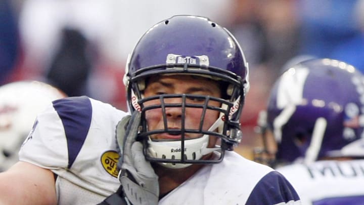 January 1,2010; Tampa, FL, USA;  Auburn Tigers defensive end Antonio Coleman (52) rushes past Northwestern Wildcats offensive lineman Al Netter (75) during the second half of the 2010 Outback Bowl at Raymond James Stadium. Auburn won 38-35.