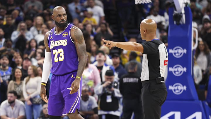 Mar 21, 2026; Orlando, Florida, USA; Los Angeles Lakers forward LeBron James (23) reacts to a call by referee Marc Davis (8) in the fourth quarter at Kia Center. Mandatory Credit: Nathan Ray Seebeck-Imagn Images