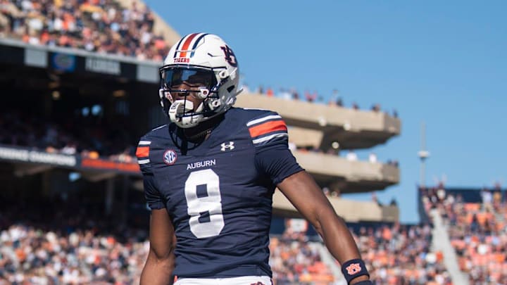 Auburn Tigers wide receiver Cam Coleman (8) jumps into the end zone for a touchdown after a catch as Auburn Tigers take on Louisiana-Monroe Warhawks at Jordan-Hare Stadium in Auburn, Ala., on Saturday, Nov. 16, 2024.