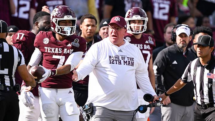 Dec 20, 2025; College Station, TX, USA; Texas A&M Aggies head coach Mike Elko reacts to a call during the game between the Aggies and the Hurricanes at Kyle Field. Mandatory Credit: Jerome Miron-Imagn Images Dec 20, 2025; College Station, TX, USA; Texas A&M Aggies head coach Mike Elko reacts to a call during the game between the Aggies and the Hurricanes at Kyle Field. Mandatory Credit: Jerome Miron-Imagn Images
