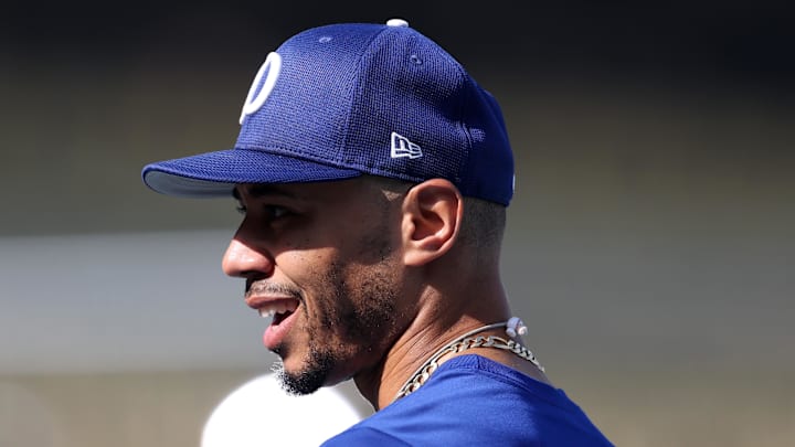 Oct 27, 2025; Los Angeles, California, USA; Los Angeles Dodgers shortstop Mookie Betts (50) warms up before game three of the 2025 MLB World Series against the Toronto Blue Jays at Dodger Stadium. Mandatory Credit: Kiyoshi Mio-Imagn Images