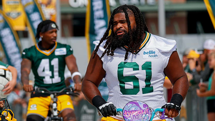 Green Bay Packers offensive lineman Lecitus Smith (61) rides a young fan’s bicycle to practice at training camp last year. Green Bay Packers offensive lineman Lecitus Smith (61) rides a young fan’s bicycle to practice at training camp last year.