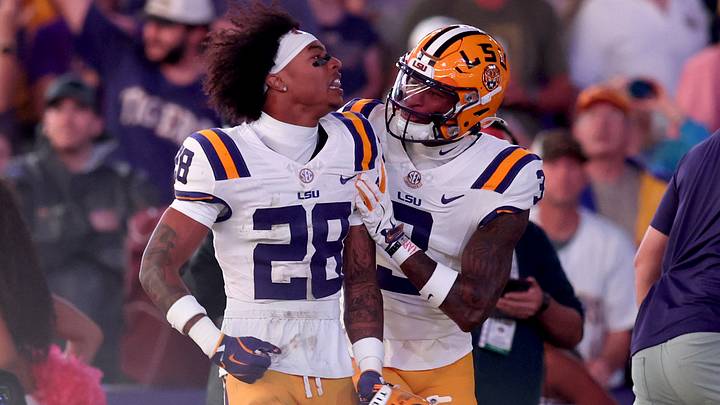 LSU Tigers safety Jhase Thomas (28) celebrates with cornerback DJ Pickett (3) after a play during the first half against the Texas A&M Aggies at Tiger Stadium. 