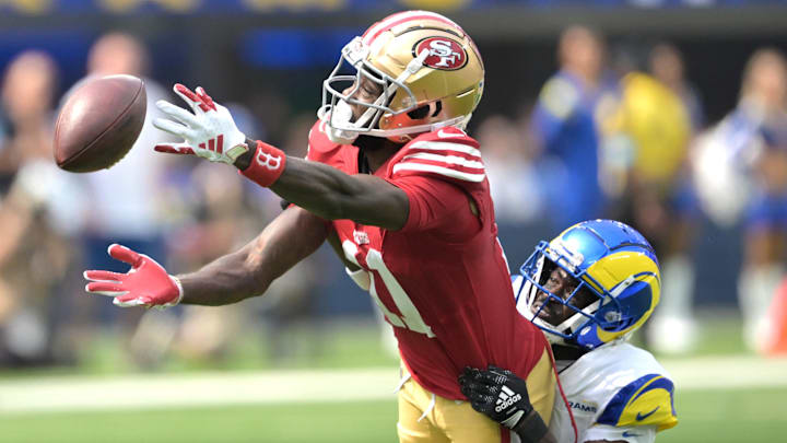 Sep 22, 2024; Inglewood, California, USA;  Los Angeles Rams cornerback Tre'Davious White (27) defends San Francisco 49ers wide receiver Brandon Aiyuk (11) on a pass play in the first half at SoFi Stadium. Mandatory Credit: Jayne Kamin-Oncea-Imagn Images