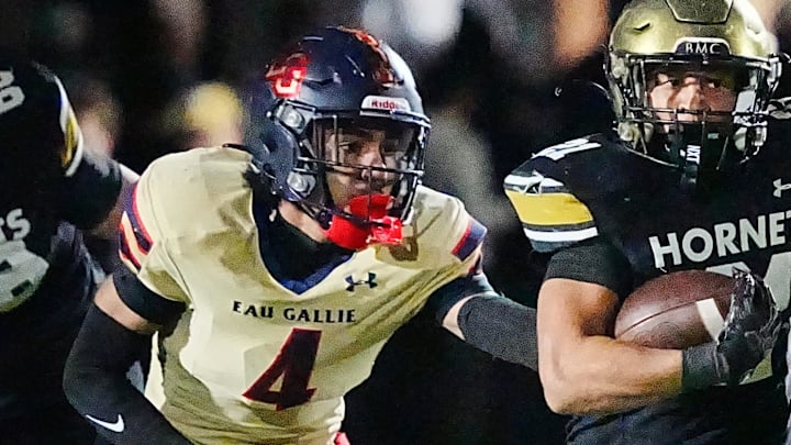 Gabriel Player of Eau Gallie chases Bishop Moore ballcarrier Amar’e Johnson in the regional finals of the Class 3A football championship November 28, 2025.