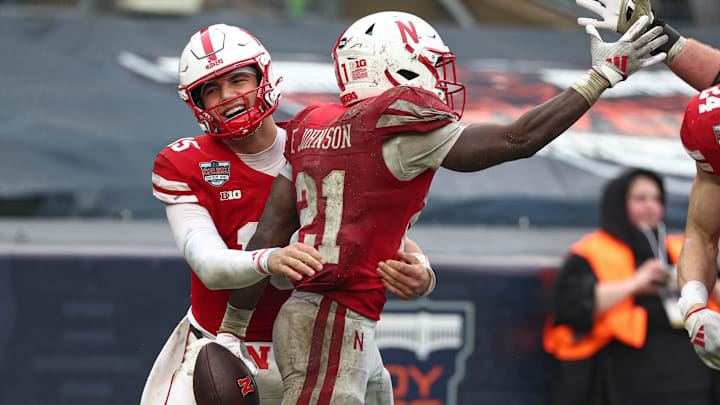 Nebraska running back Emmett Johnson celebrates with quarterback Dylan Raiola after Johnson's 13-yard touchdown reception during the third quarter of the Pinstripe Bowl.