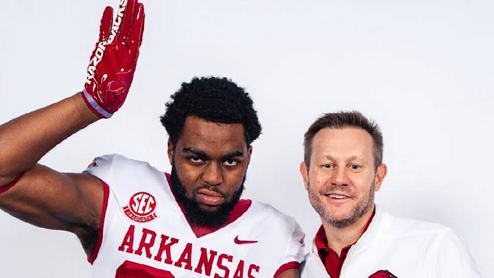 Arkansas Razorbacks EDGE rusher Steven Soles Jr. (left) with coach Ryan Silverfield during his visit to Fayetteville. Arkansas Razorbacks EDGE rusher Steven Soles Jr. (left) with coach Ryan Silverfield during his visit to Fayetteville.