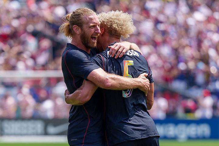 Tim Ream hugging Robinson