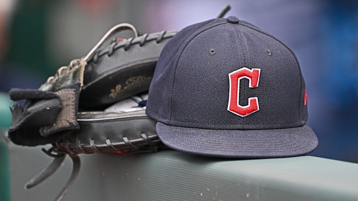 Jun 27, 2024; Kansas City, Missouri, USA; A general view a Cleveland Guardians hat and glove on the dugout railing before a game against the Kansas City Royals at Kauffman Stadium. Jun 27, 2024; Kansas City, Missouri, USA; A general view a Cleveland Guardians hat and glove on the dugout railing before a game against the Kansas City Royals at Kauffman Stadium.