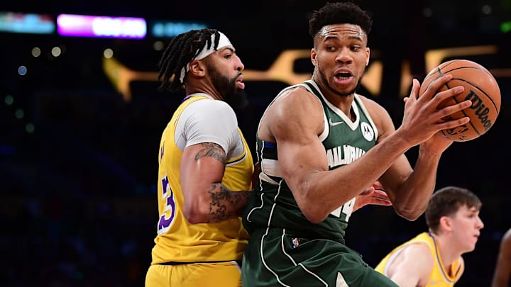 Feb 8, 2022; Los Angeles, California, USA; Milwaukee Bucks forward Giannis Antetokounmpo (34) moves the ball against Los Angeles Lakers forward Anthony Davis (3) during the second half at Crypto.com Arena. Mandatory Credit: Gary A. Vasquez-Imagn Images