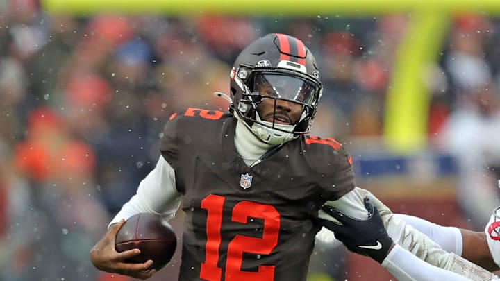Cleveland Browns quarterback Shedeur Sanders (12) picks up a first down on his feet ahead of Tennessee Titans linebacker Cedric Gray (33) during the first half of an NFL football game at Huntington Bank Field, Dec. 7, 2025, in Cleveland, Ohio. Cleveland Browns quarterback Shedeur Sanders (12) picks up a first down on his feet ahead of Tennessee Titans linebacker Cedric Gray (33) during the first half of an NFL football game at Huntington Bank Field, Dec. 7, 2025, in Cleveland, Ohio.