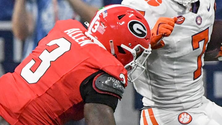 Aug 31, 2024; Atlanta, Georgia, USA; Clemson Tigers running back Phil Mafah (7) runs against Georgia Bulldogs linebacker CJ Allen (3) during the first quarter of the 2024 Aflac Kickoff Game at Mercedes-Benz Stadium. Mandatory Credit: Ken Ruinard-Imagn Images Aug 31, 2024; Atlanta, Georgia, USA; Clemson Tigers running back Phil Mafah (7) runs against Georgia Bulldogs linebacker CJ Allen (3) during the first quarter of the 2024 Aflac Kickoff Game at Mercedes-Benz Stadium. Mandatory Credit: Ken Ruinard-Imagn Images