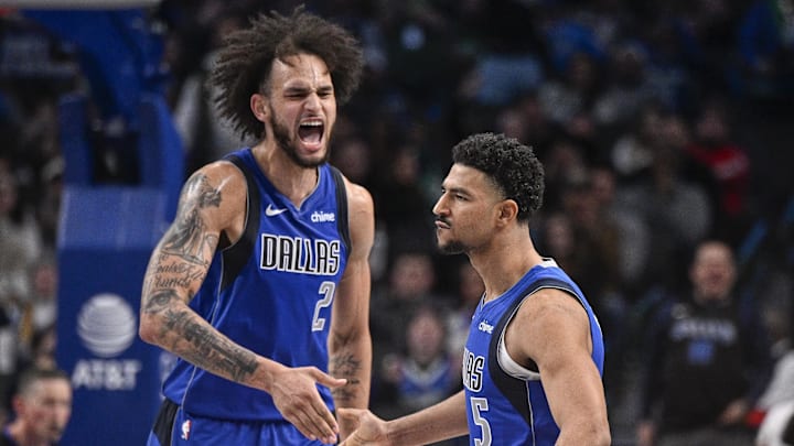 Jan 9, 2025; Dallas, Texas, USA; Dallas Mavericks center Dereck Lively II (2) and guard Quentin Grimes (5) celebrate during the second half against the Portland Trail Blazers at the American Airlines Center. Mandatory Credit: Jerome Miron-Imagn Images