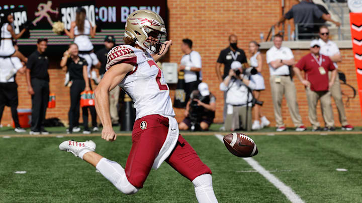 Sep 18, 2021; Winston-Salem, North Carolina, USA; Florida State Seminoles punter Alex Mastromanno (21) kicks the ball during the first quarter against the Wake Forest Demon Deacons at Truist Field. Mandatory Credit: Reinhold Matay-Imagn Images