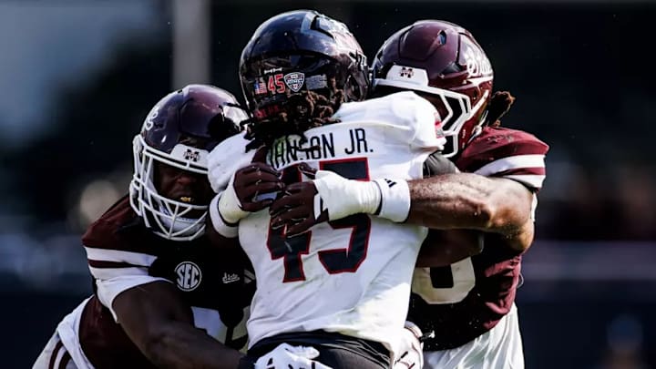 Mississippi State Defensive Lineman Jaray Bledsoe (#92) and Mississippi State Linebacker Nic Mitchell (#40) during the game between the Northern Illinois Huskies and the Mississippi State Bulldogs at Davis Wade Stadium at Scott Field in Starkville, MS.