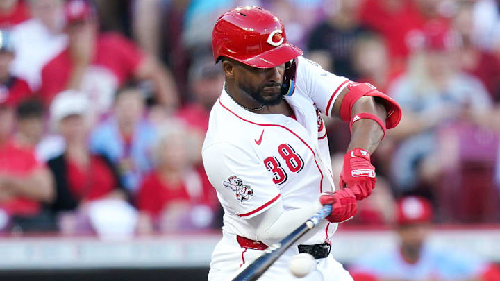 Cincinnati Reds designated hitter Miguel Andujar (38) hits a single in the first inning of a MLB game between the Cincinnati Reds and St. Louis Cardinals, Aug. 30, 2025, at Great American Ball Park in downtown Cincinnati.