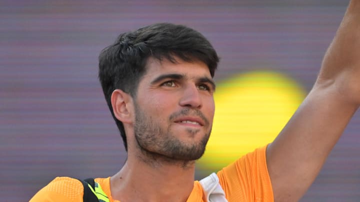 Carlos Alcaraz waves as he leaves the court Carlos Alcaraz waves as he leaves the court