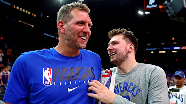 May 15, 2022; Phoenix, Arizona, USA; Dallas Mavericks guard Luka Doncic (77) greets former player Dirk Nowitzki after beating the Phoenix Suns in game seven of the second round for the 2022 NBA playoffs at Footprint Center. Mandatory Credit: Mark J. Rebilas-Imagn Images