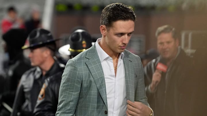 Georgia quarterback Carson Beck (15) arrives before the start of a NCAA college football game against Georgia Tech in Athens, Ga., on Friday, Nov. 29, 2024.