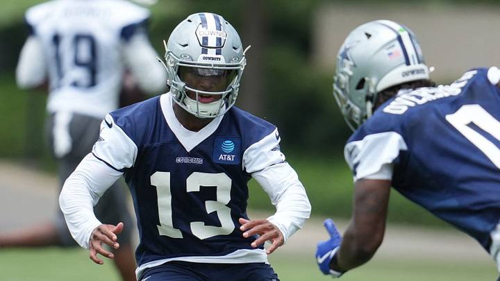 Dallas Cowboys safety Caleb Downs and linebacker DeMarvion Overshown go through a drill during practice at The Star Dallas Cowboys safety Caleb Downs and linebacker DeMarvion Overshown go through a drill during practice at The Star