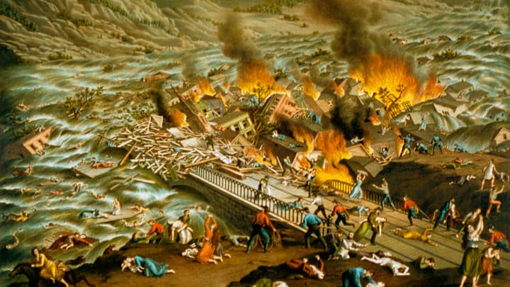 A lithograph of the 1889 Johnstown Flood made in the 1890s shows the debris caused by the flood in flames.