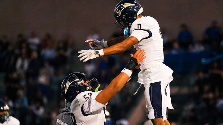 Senior Caption Pablo Granados celebrates with Paul Turner Jr. after a Birmingham Touchdown 