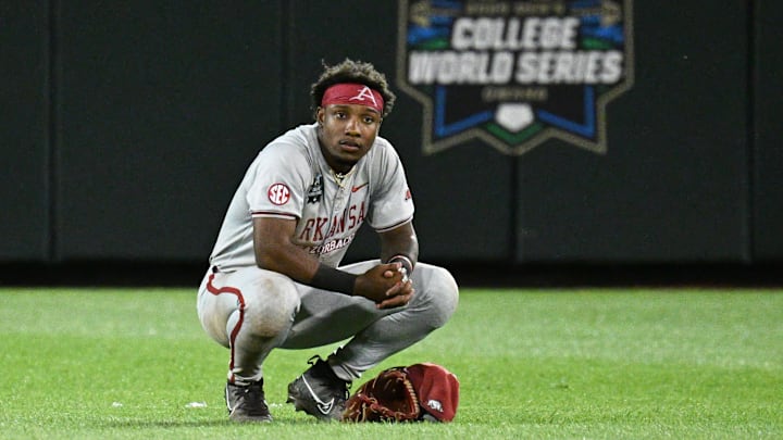 Arkansas Razorbacks center fielder Justin Thomas Jr. was shocked after the Hogs blew a two-run lead in the ninth inning against the LSU Tigers at Charles Schwab Field in Omaha, Neb.
