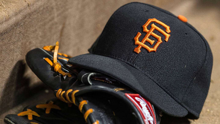 Jul 31, 2015; Arlington, TX, USA; A view of a San Francisco Giants baseball hat and glove during the game between the Texas Rangers and the San Francisco Giants at Globe Life Park in Arlington. The Rangers defeated the Giants 6-3. Mandatory Credit: Jerome Miron-Imagn Images Jul 31, 2015; Arlington, TX, USA; A view of a San Francisco Giants baseball hat and glove during the game between the Texas Rangers and the San Francisco Giants at Globe Life Park in Arlington. The Rangers defeated the Giants 6-3. Mandatory Credit: Jerome Miron-Imagn Images