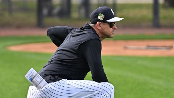 Feb 16, 2026; Tampa, FL, USA; New York Yankees manager Aaron Boone (17) watches players workout during spring training at George M. Steinbrenner Field. Mandatory Credit: Jonathan Dyer-Imagn Images Feb 16, 2026; Tampa, FL, USA; New York Yankees manager Aaron Boone (17) watches players workout during spring training at George M. Steinbrenner Field. Mandatory Credit: Jonathan Dyer-Imagn Images