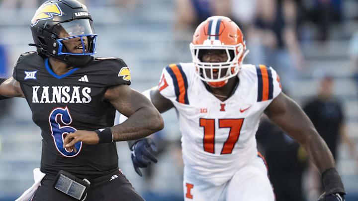 Sep 8, 2023; Lawrence, Kansas, USA; Kansas Jayhawks quarterback Jalon Daniels (6) throws a pass against Illinois Fighting Illini linebacker Gabe Jacas (17) during the first half at David Booth Kansas Memorial Stadium. Mandatory Credit: Jay Biggerstaff-Imagn Images