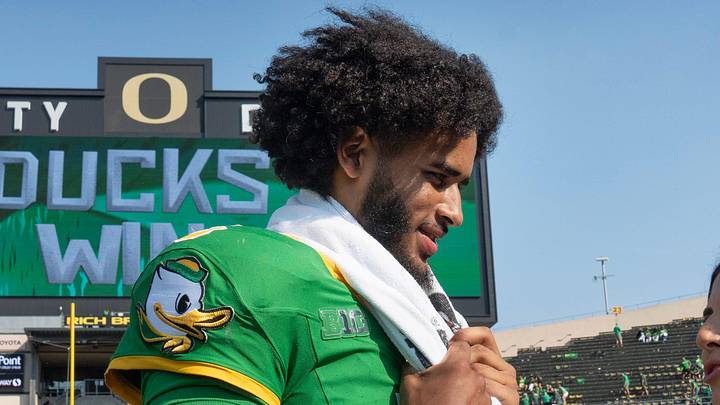 Oregon quarterback Dante Moore is interviewed on the field after the win over Oklahoma State at Autzen. Oregon quarterback Dante Moore is interviewed on the field after the win over Oklahoma State at Autzen.