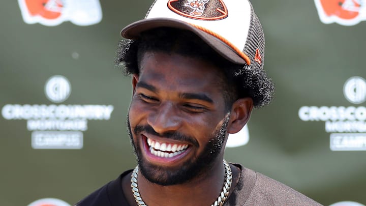 Cleveland Browns quarterback Shedeur Sanders (12) jokes about his signing bonus during a press conference before day two of NFL rookie minicamp at the Cleveland Browns training facility on Saturday, May 10, 2025, in Berea, Ohio.