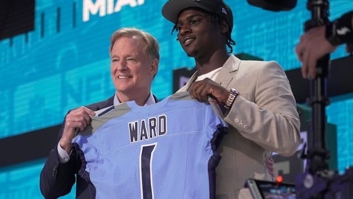 Cam Ward, QB, from Miami holds a jersey with NFL Commissioner Roger Goodell after being selected 1st overall by the Tennessee Titans during the first round of the 2025 NFL Draft at Lambeau Field on April 24, 2025 in Green Bay, Wisconsin.