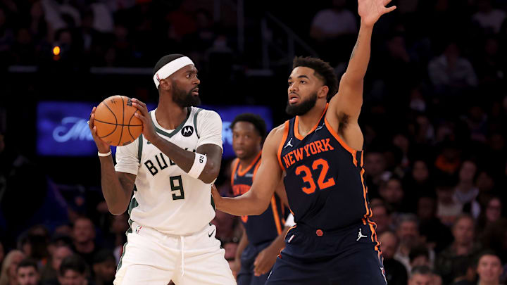 Nov 8, 2024; New York, New York, USA; Milwaukee Bucks forward Bobby Portis (9) looks to pass the ball against New York Knicks center Karl-Anthony Towns (32) during the fourth quarter at Madison Square Garden. Mandatory Credit: Brad Penner-Imagn Images
