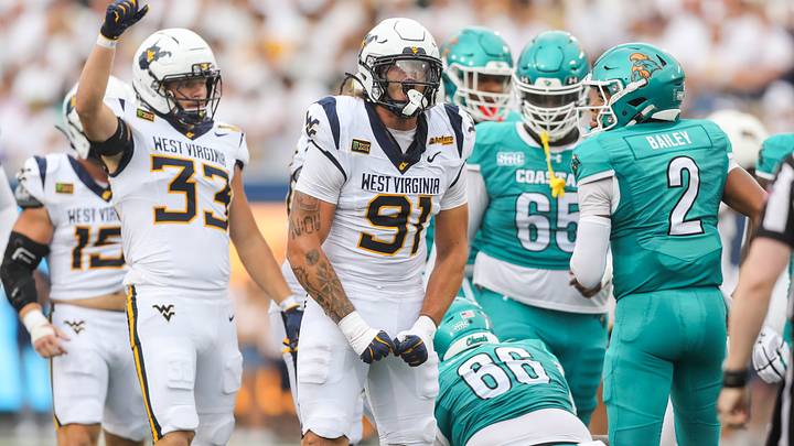 Sep 5, 2026; Morgantown, West Virginia, USA;  West Virginia Mountaineers defensive lineman Darius Wiley (91) celebrates after a defensive stop during the first quarter against the Coastal Carolina Chanticleers at Milan Puskar Stadium.  Mandatory Credit: Ben Queen-Imagn Images